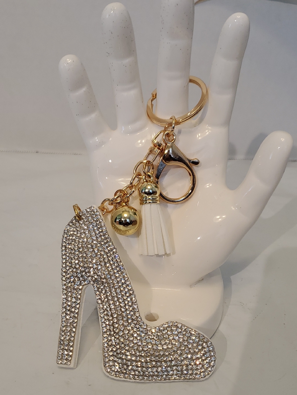 Gold Rhinestone High Heel Keychain with White Tassel. NWOT